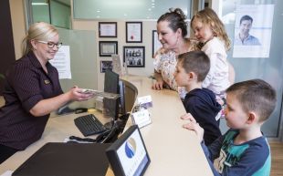 At what age should a child make his or her first trip to the Dentist?